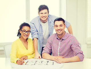 Image showing three smiling architects working in office