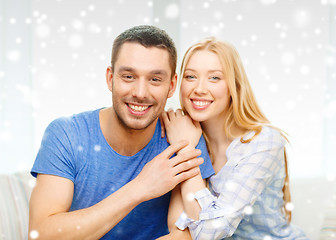 Image showing happy couple hugging at home