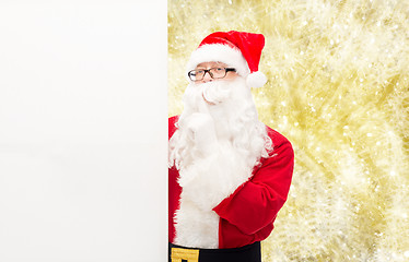 Image showing man in costume of santa claus with billboard