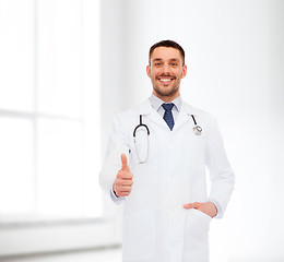 Image showing smiling doctor with stethoscope showing thumbs up