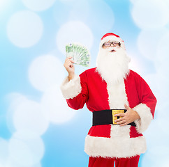 Image showing man in costume of santa claus with euro money