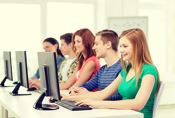 Image showing female student with classmates in computer class