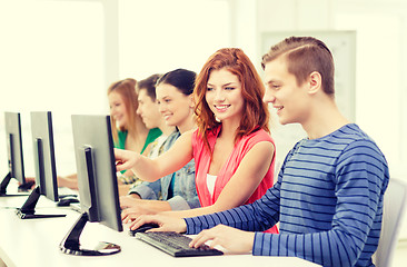 Image showing female student with classmates in computer class