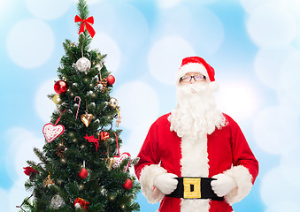 Image showing man in costume of santa claus with christmas tree