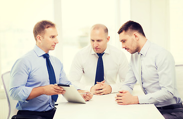 Image showing business team working with tablet pc in office