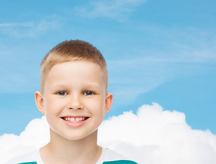 Image showing smiling little boy over green background