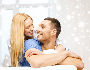 Image showing happy couple hugging at home