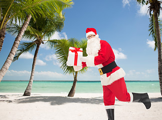 Image showing man in costume of santa claus with gift box