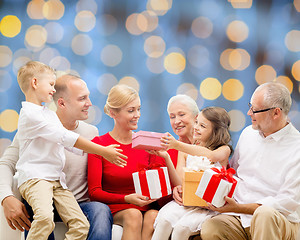 Image showing smiling family with gifts