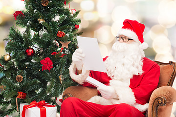 Image showing man in costume of santa claus with letter