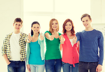 Image showing smiling students at school showing thumbs up