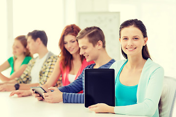 Image showing smiling students with tablet pc at school