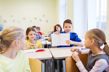 Image showing group of school kids writing test in classroom