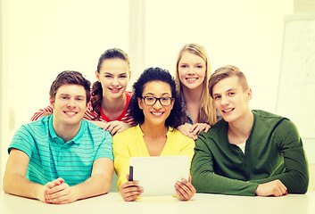 Image showing smiling students with tablet pc computer at school