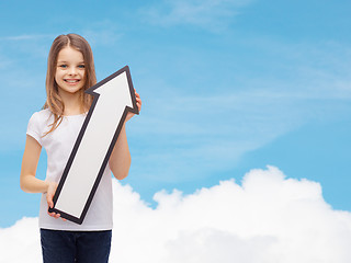 Image showing smiling little girl with blank arrow pointing up