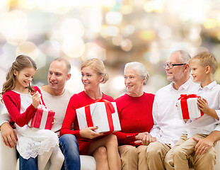 Image showing smiling family with gifts
