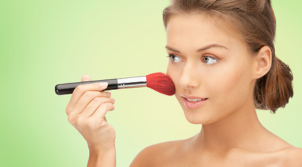 Image showing beautiful smiling woman with make up brush