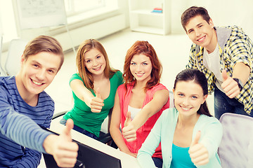 Image showing group of smiling students showing thumbs up