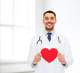 Image showing smiling male doctor with red heart