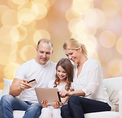 Image showing happy family with tablet pc and credit card