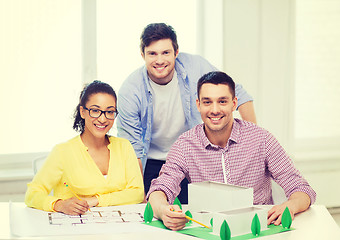 Image showing smiling architects working in office