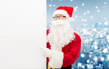 Image showing man in costume of santa claus with billboard