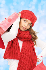 Image showing smiling young woman with shopping bags