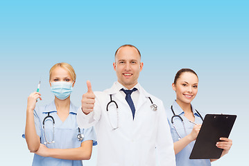 Image showing group of smiling doctors with showing thumbs up