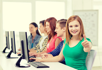 Image showing female student with classmates in computer class