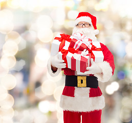 Image showing man in costume of santa claus with gift boxes