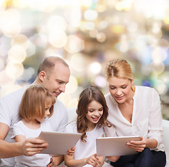 Image showing happy family with tablet pc computers