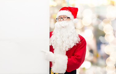 Image showing man in costume of santa claus with billboard