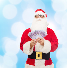 Image showing man in costume of santa claus with euro money