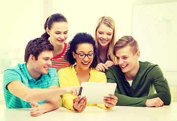 Image showing smiling students with tablet pc computer at school