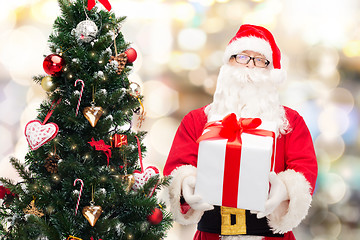 Image showing man in costume of santa claus with gift box