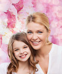 Image showing smiling mother and little girl