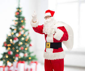 Image showing man in costume of santa claus with bag