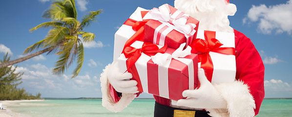 Image showing close up of santa claus with gift boxes