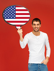 Image showing smiling man with text bubble of american flag