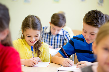 Image showing group of school kids writing test in classroom