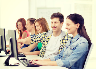 Image showing female student with classmates in computer class