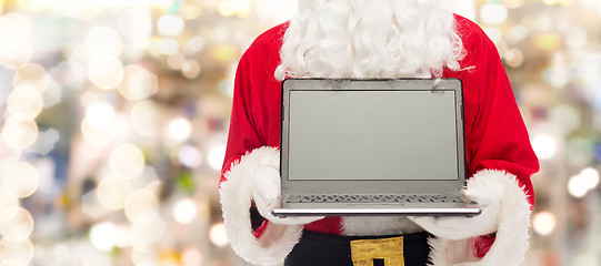 Image showing close up of santa claus with laptop