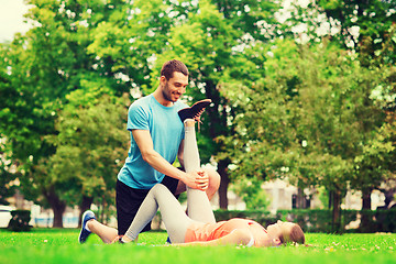 Image showing smiling couple stretching outdoors