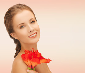 Image showing beautiful smiling young woman with flowers