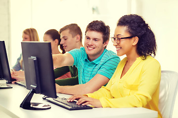 Image showing smiling students in computer class at school