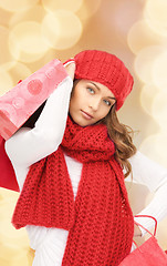 Image showing smiling young woman with shopping bags