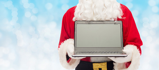 Image showing close up of santa claus with laptop