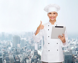 Image showing smiling chef with tablet pc showing thumbs up