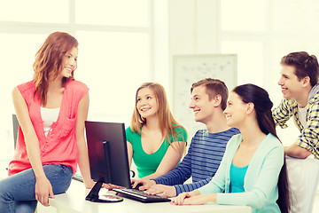 Image showing group of smiling students having discussion