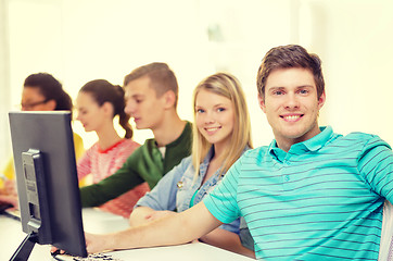 Image showing male student with classmates in computer class